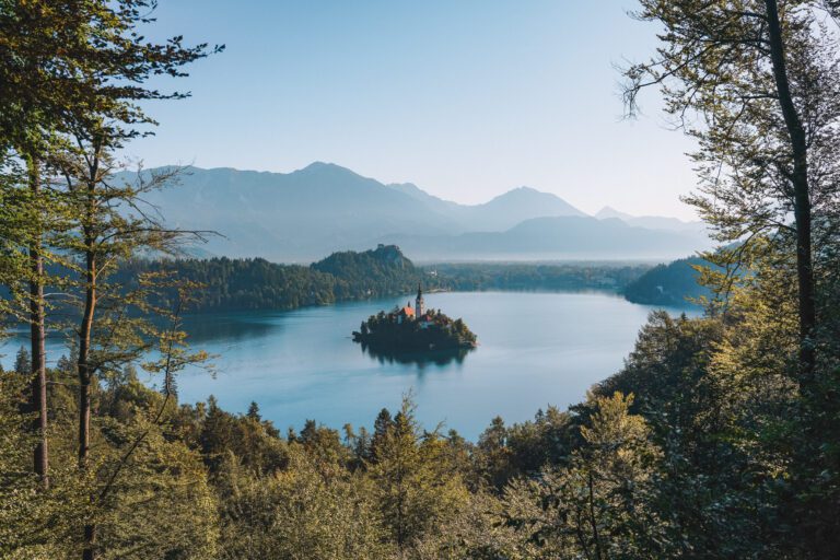 island with church in the center situated in the middle of lake bled slovenia