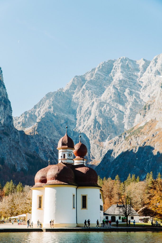St. Bartholomew's Church in Berchtesgaden National Park in Germany with mountains behind 