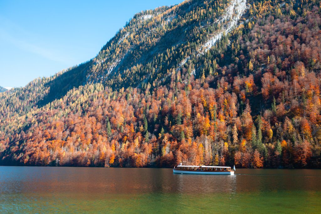 boat on Lake Konigssee in Berchtesgaden Germany with fall colors.