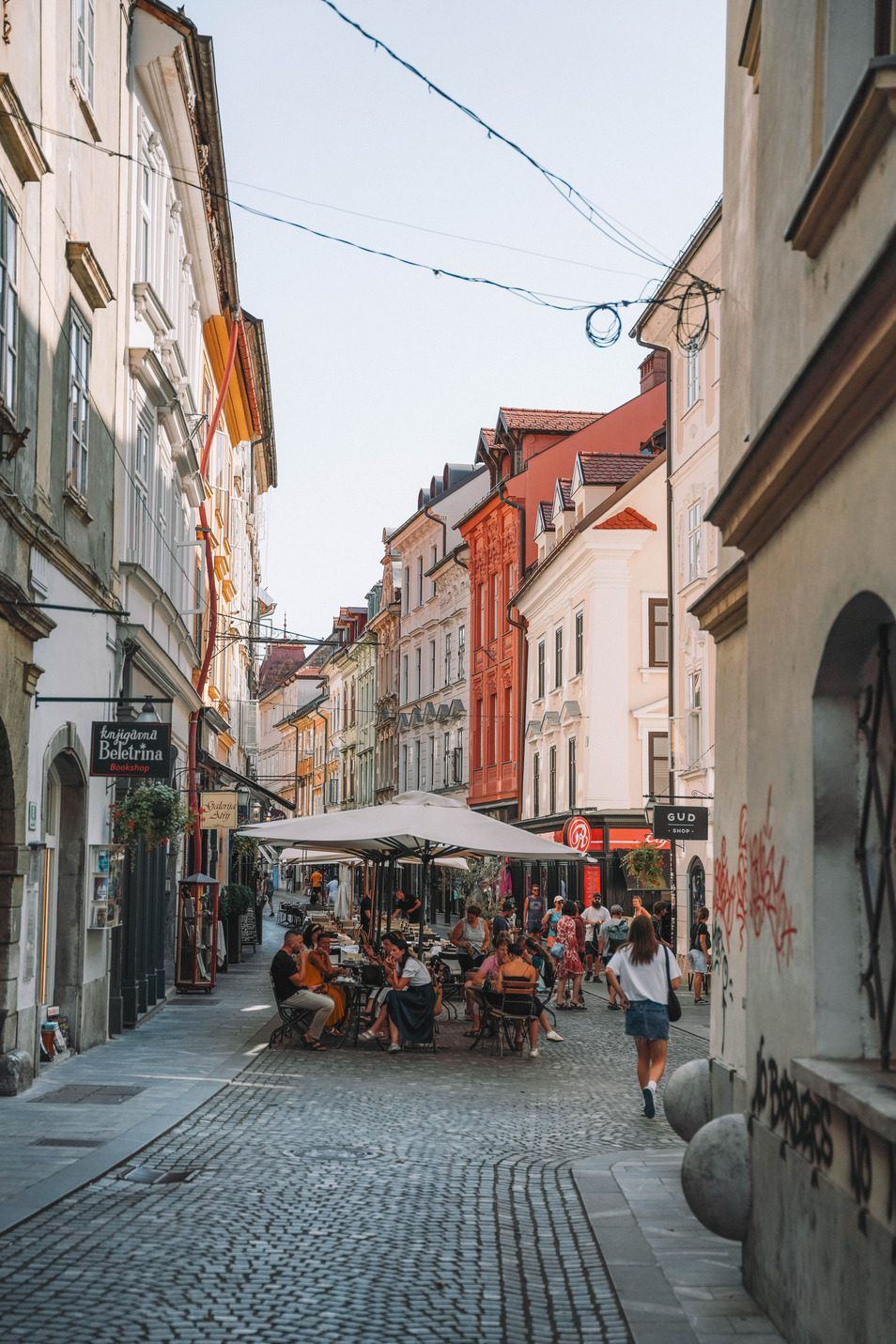 colorful buildings in european city street with outdoor dining