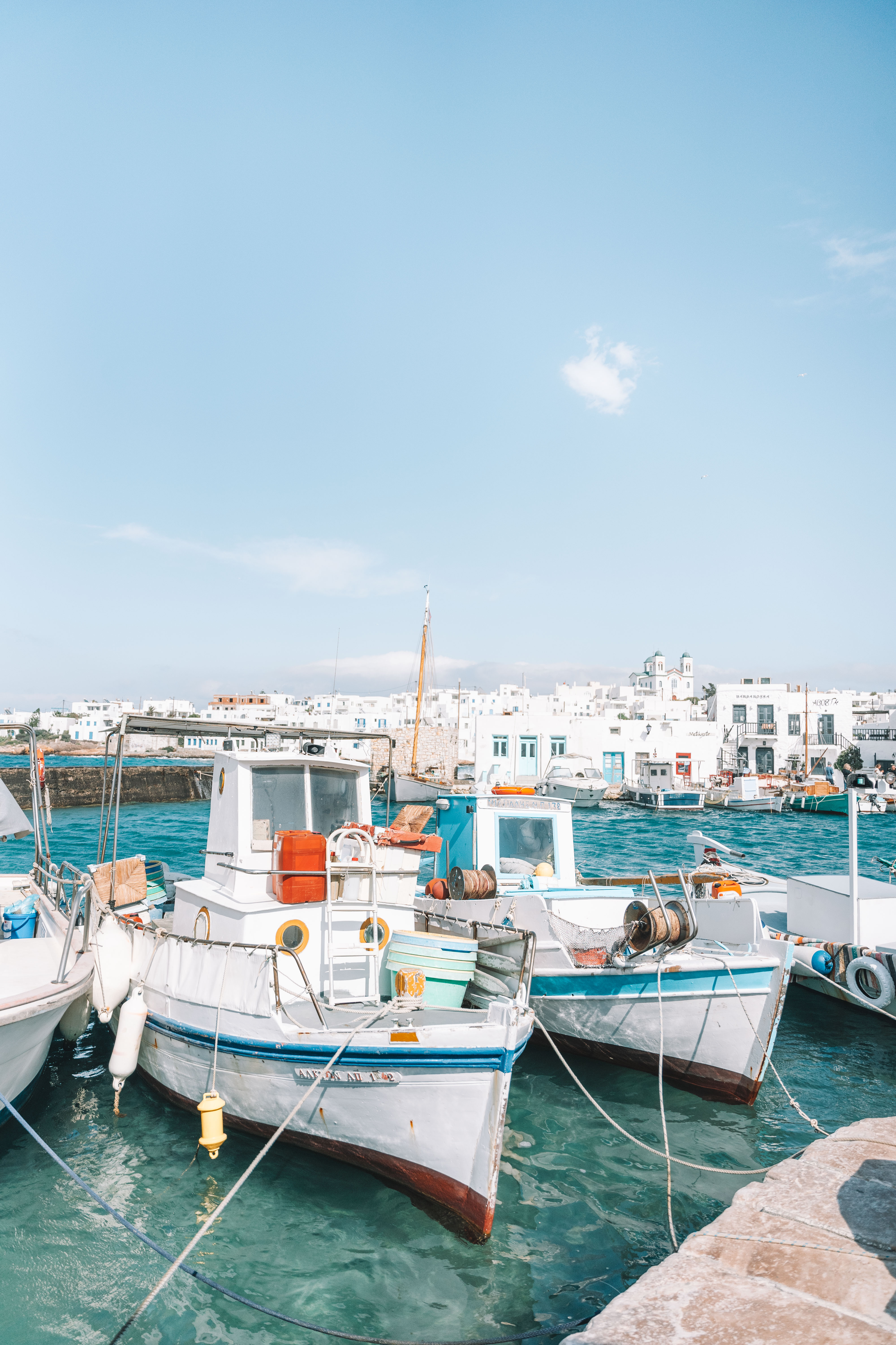 colorful boats floating anchored in port of Naousa Paros Greece 2 week greece itinerary