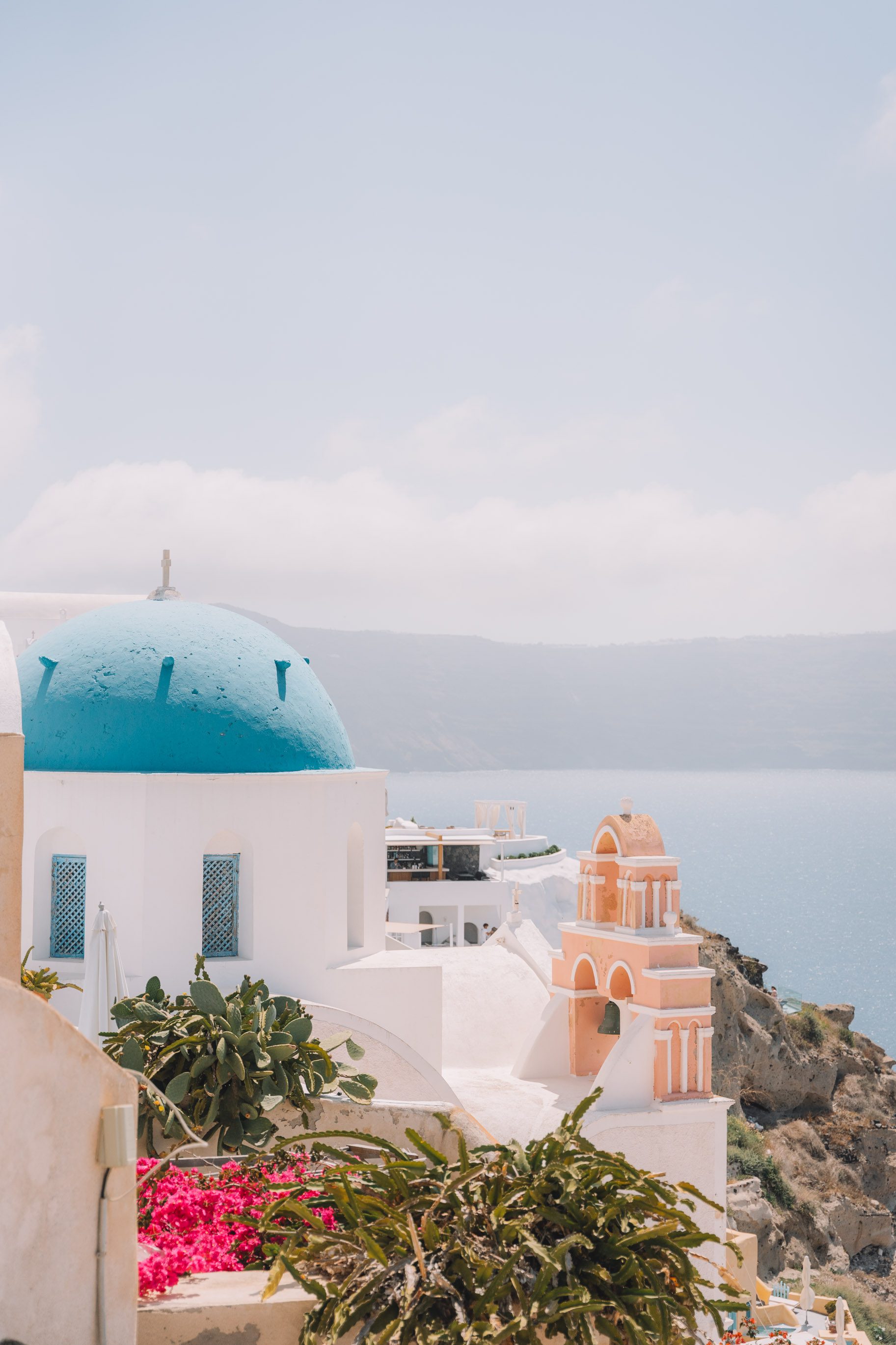 blue domed church overlooking sea in Santorini greece 2 week itinerary
