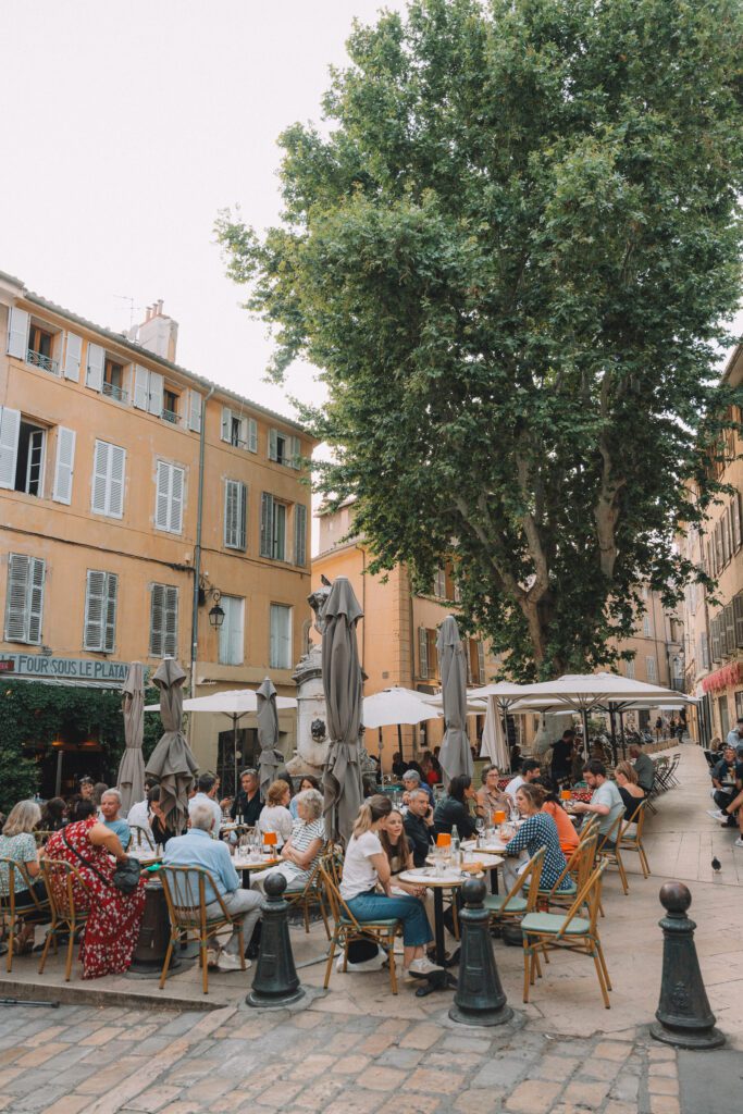 outside dining in a square with fountain in Aix-en-Provence, France
