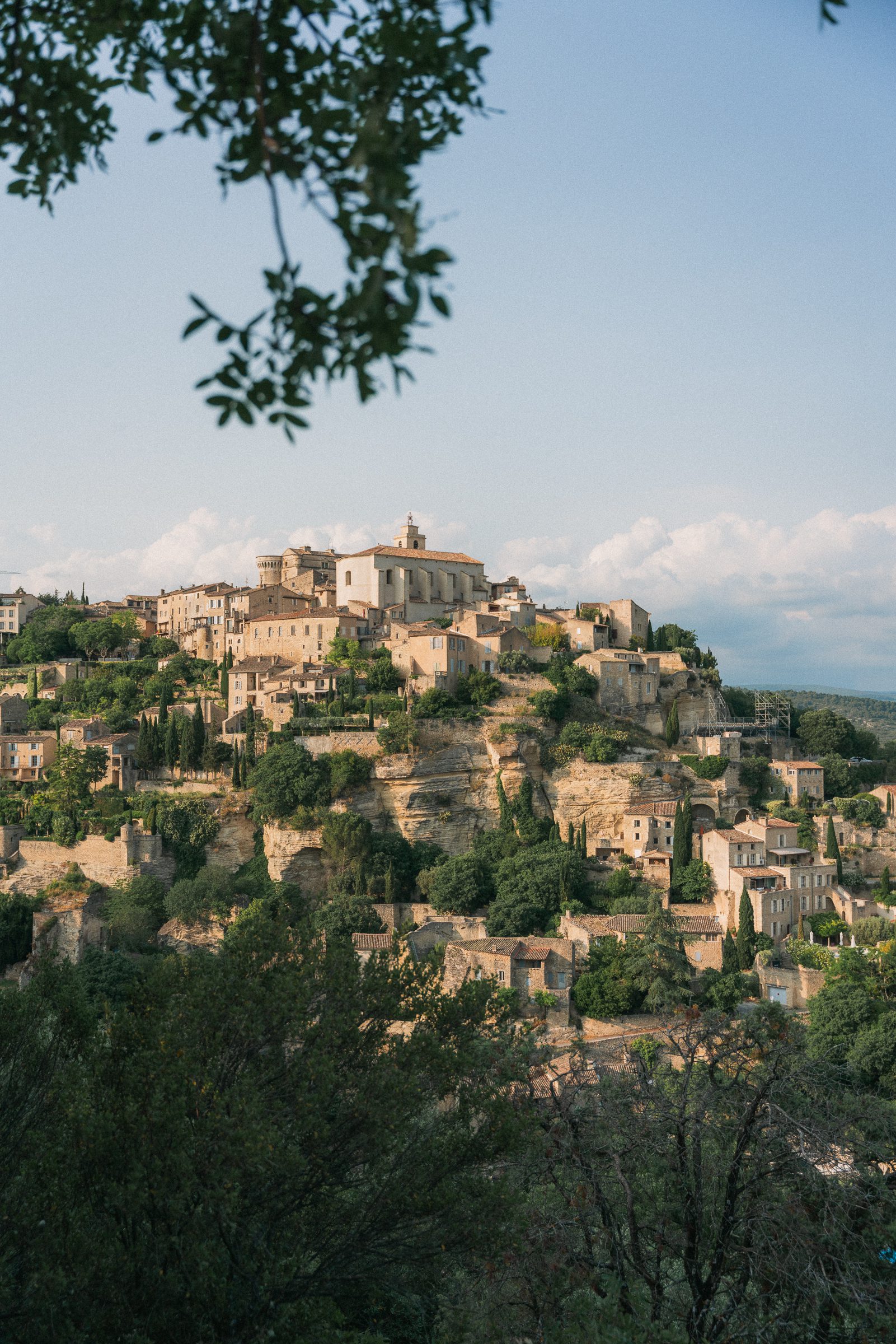 View of buildings built into cliffside in Gordes, France, Provence 10 day south of france itinerary
