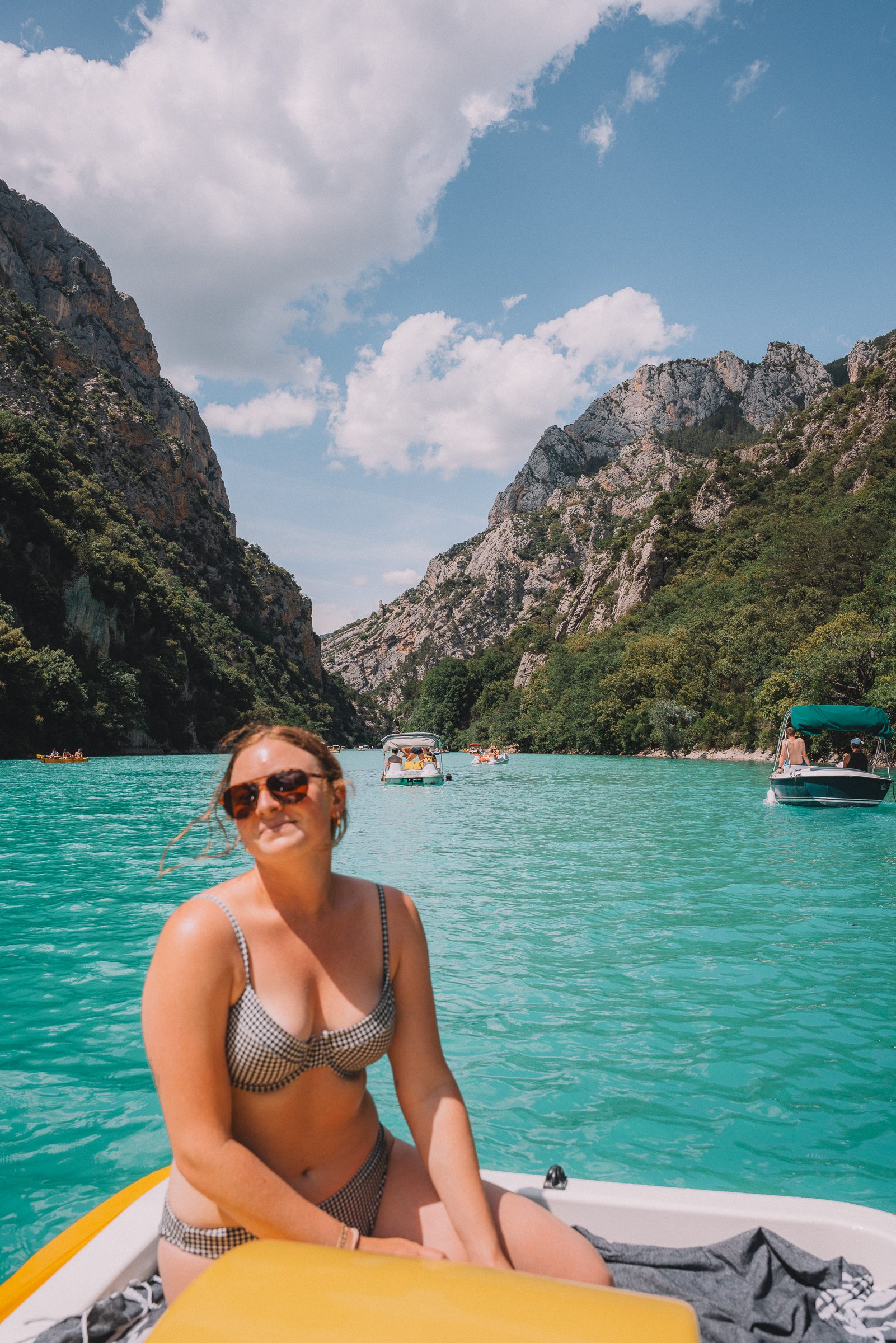 girl on boat on bright blue water in Verdon Gorge, France